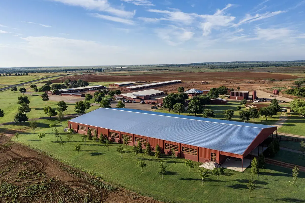 Aerial view of the Four Sixes Ranch equine facilities, including barns, arenas, and ranch buildings across the Texas landscape.